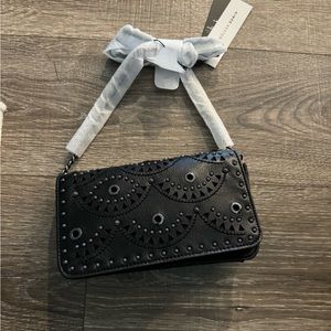 Brand new purse. Genuine black leather/ cheetah print interior. Silver chain